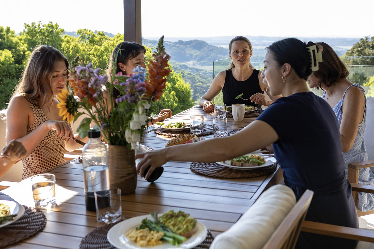 Shared lunch on the alfresco deck with hinterland views