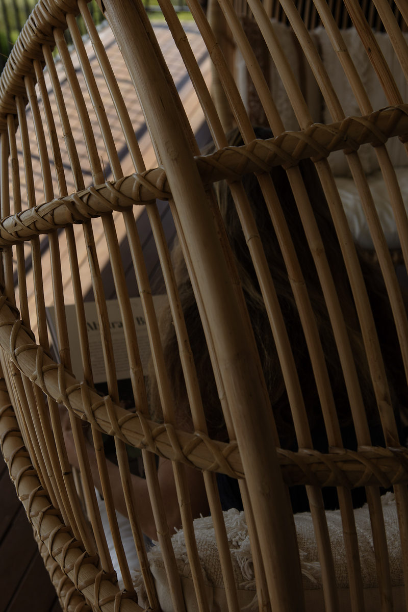Close-up of a woven rattan hanging chair
