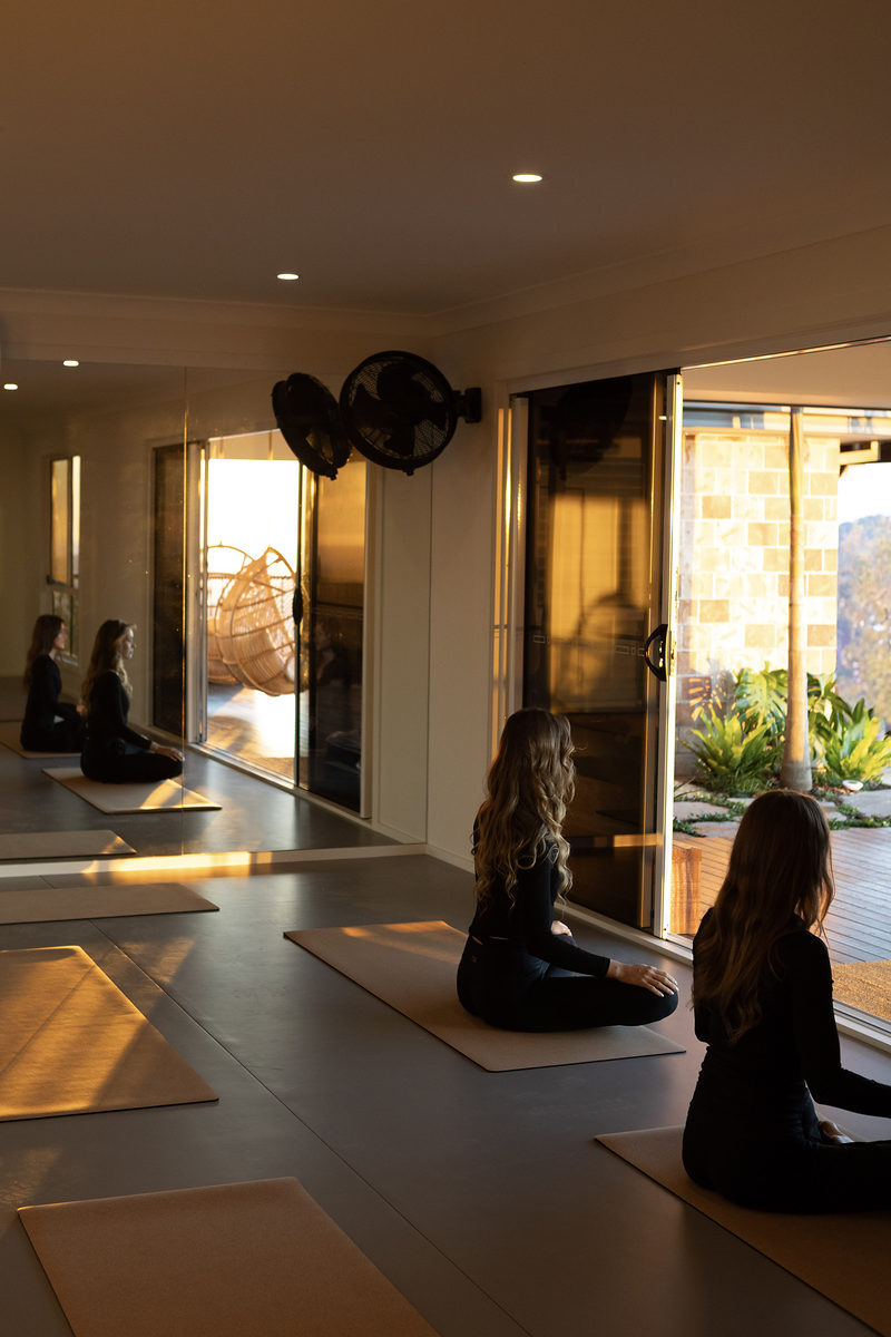 Guests stretching in the open-plan living area
