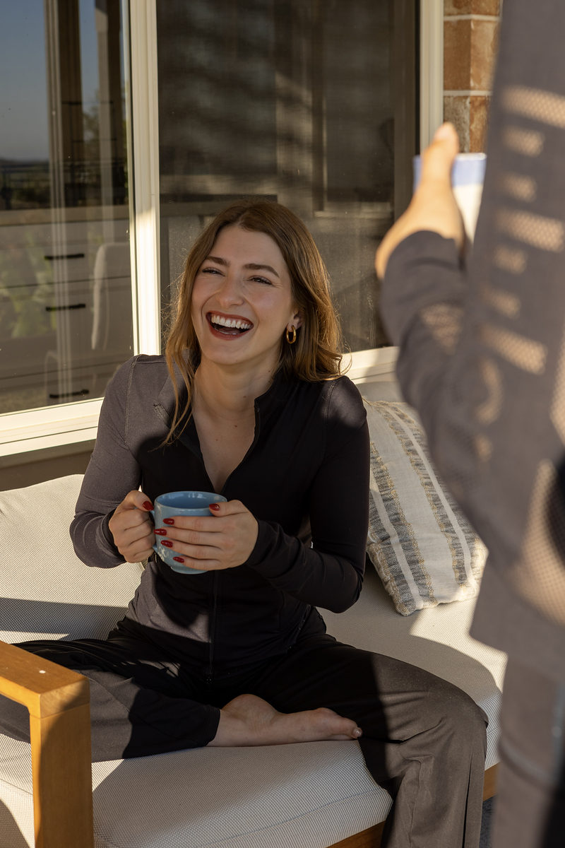 Guest laughing in the outdoor lounge