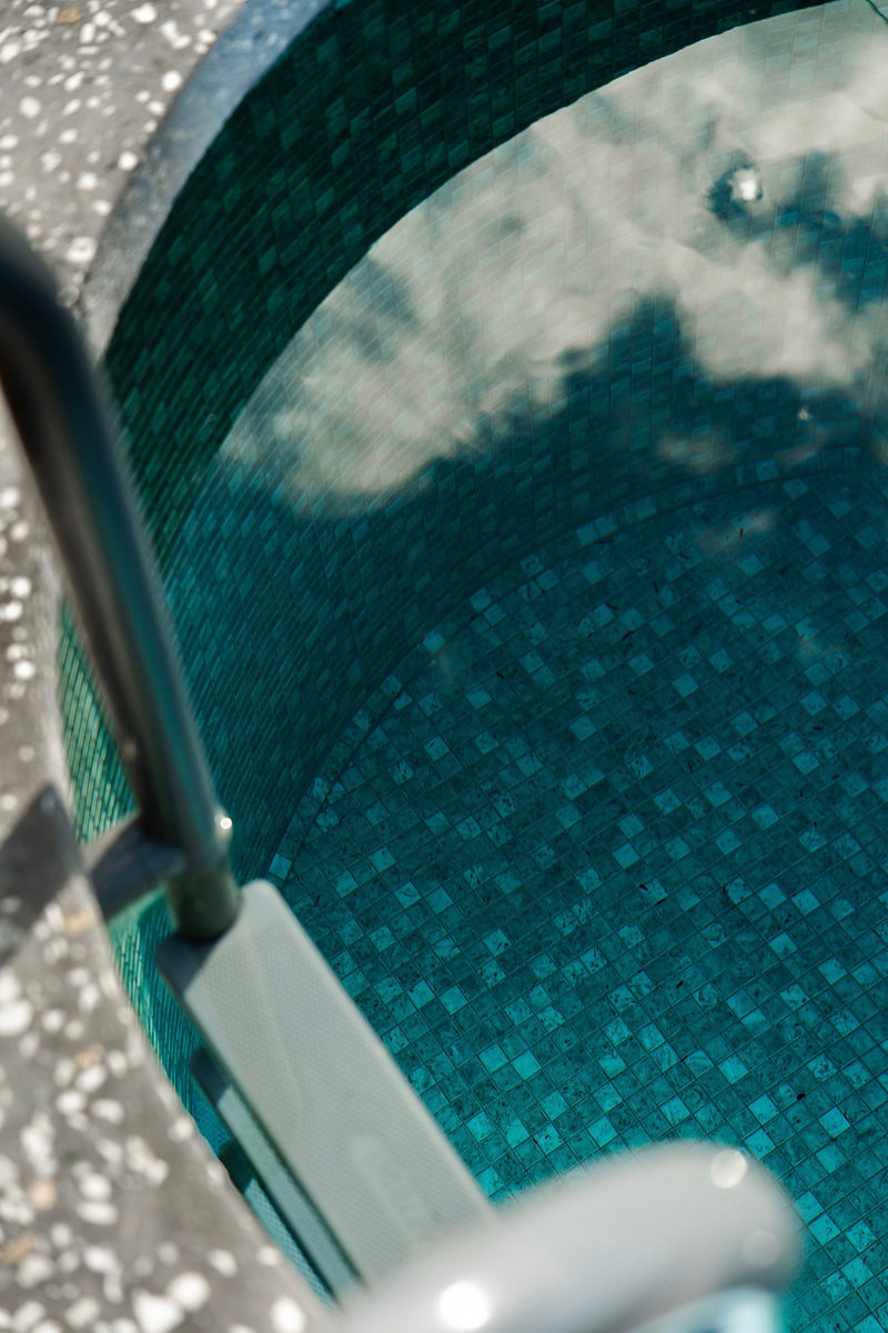 Looking down into the clear water of the plunge pool