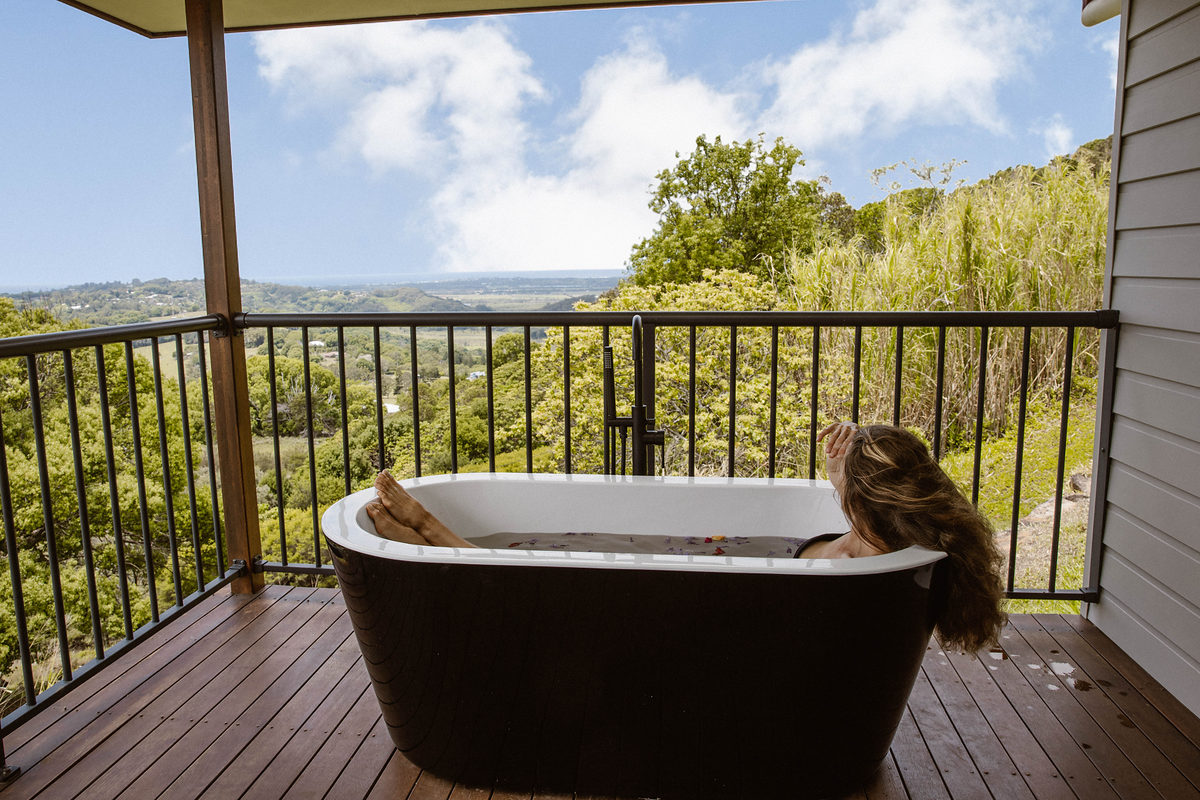 Freestanding outdoor bath on the deck overlooking the valley