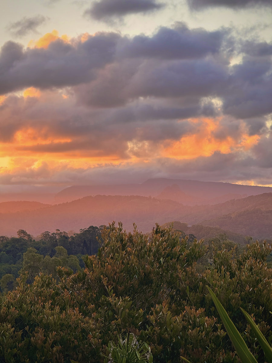 Sunset glowing behind the hinterland ridgelines