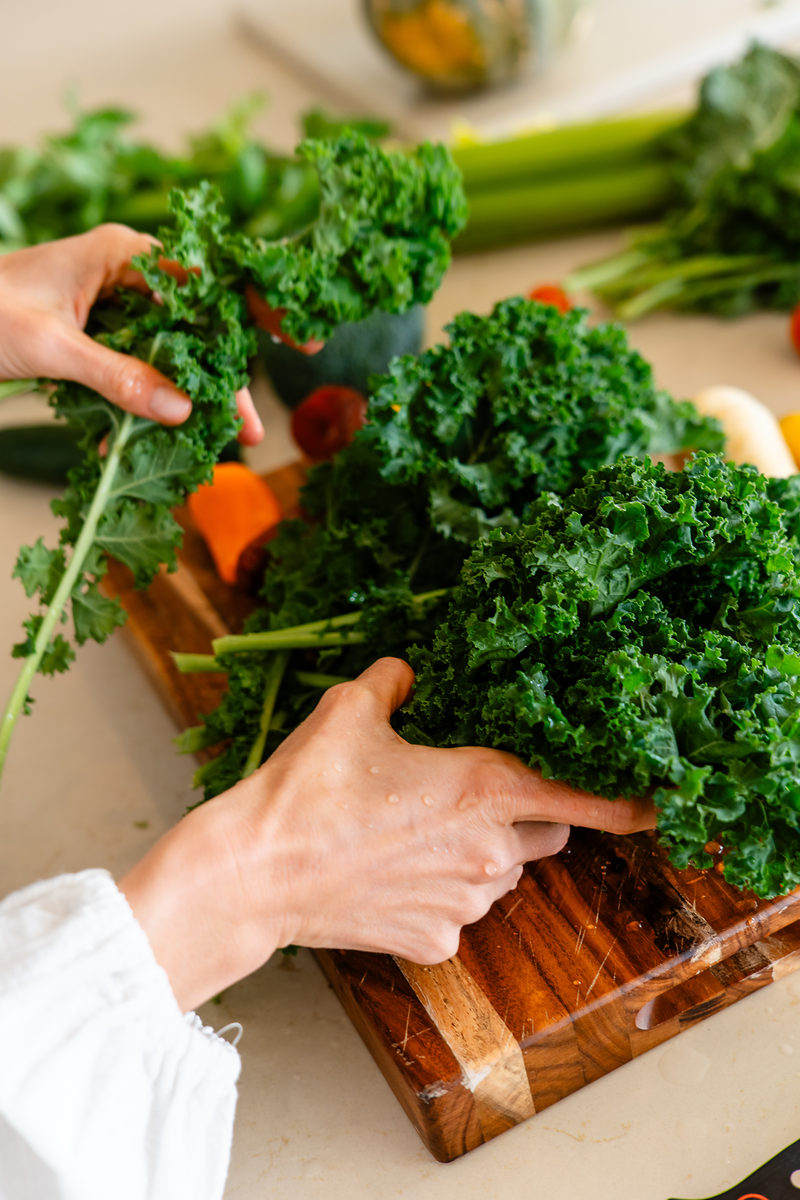Preparing fresh greens in the fully equipped kitchen