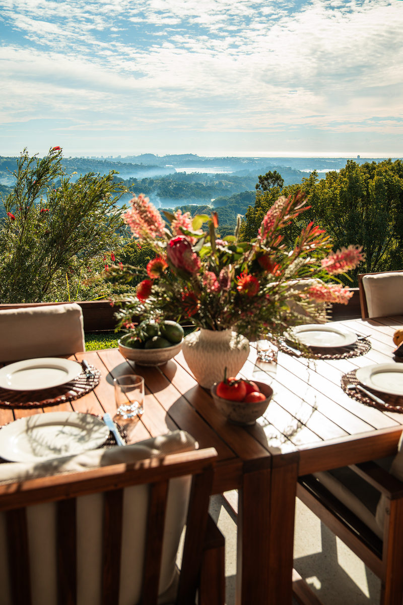 Outdoor table set for dinner with ocean views
